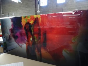 Acrylic abstract multicolored print with gloss.