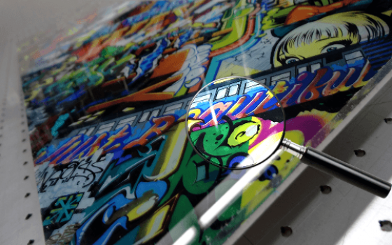 Acrylic print of multicolored urban graffiti.