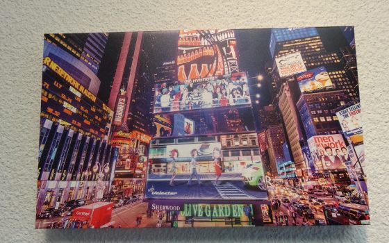 Acrylic print of a big city street with lights and billboards.