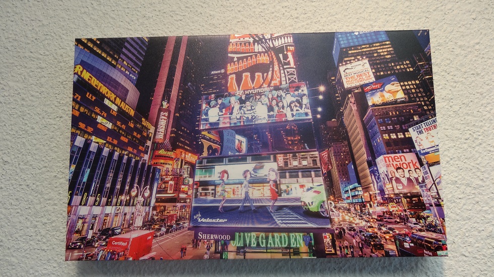 Acrylic print of a big city street with lights and billboards.