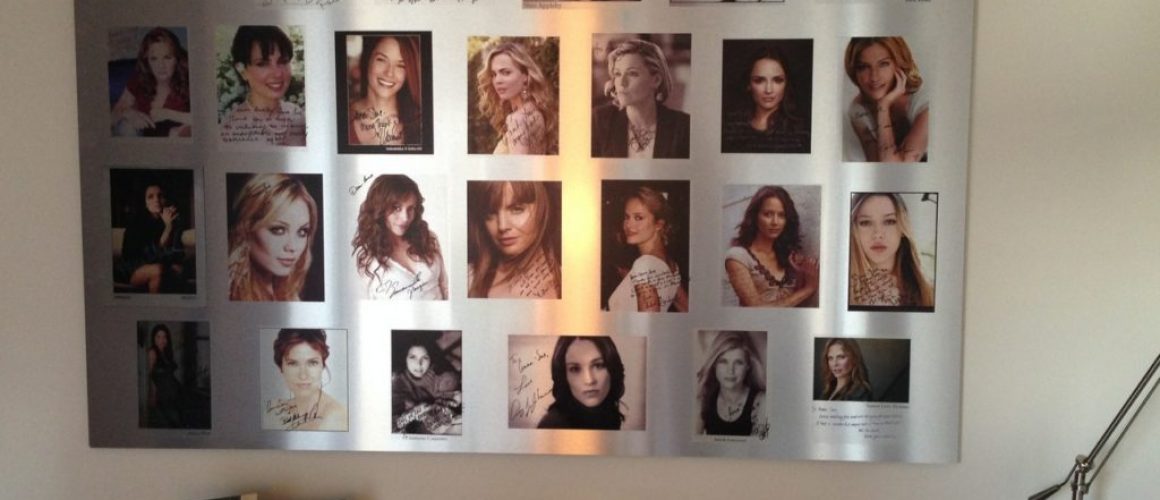 Metal print of a montage of pictures of different women and their autographs.