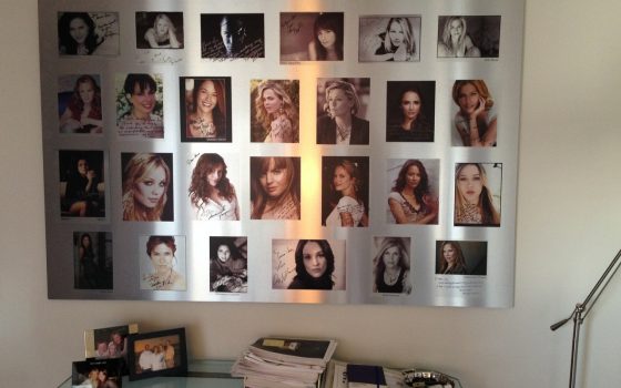 Metal print of a montage of pictures of different women and their autographs.