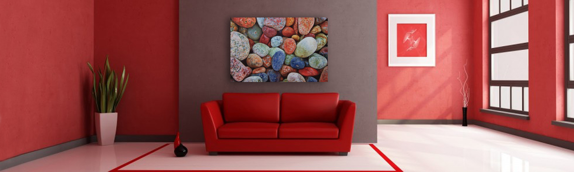 Multi colored rocks on a white washed metal background with gloss.