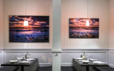 Acrylic print of sun setting over water.