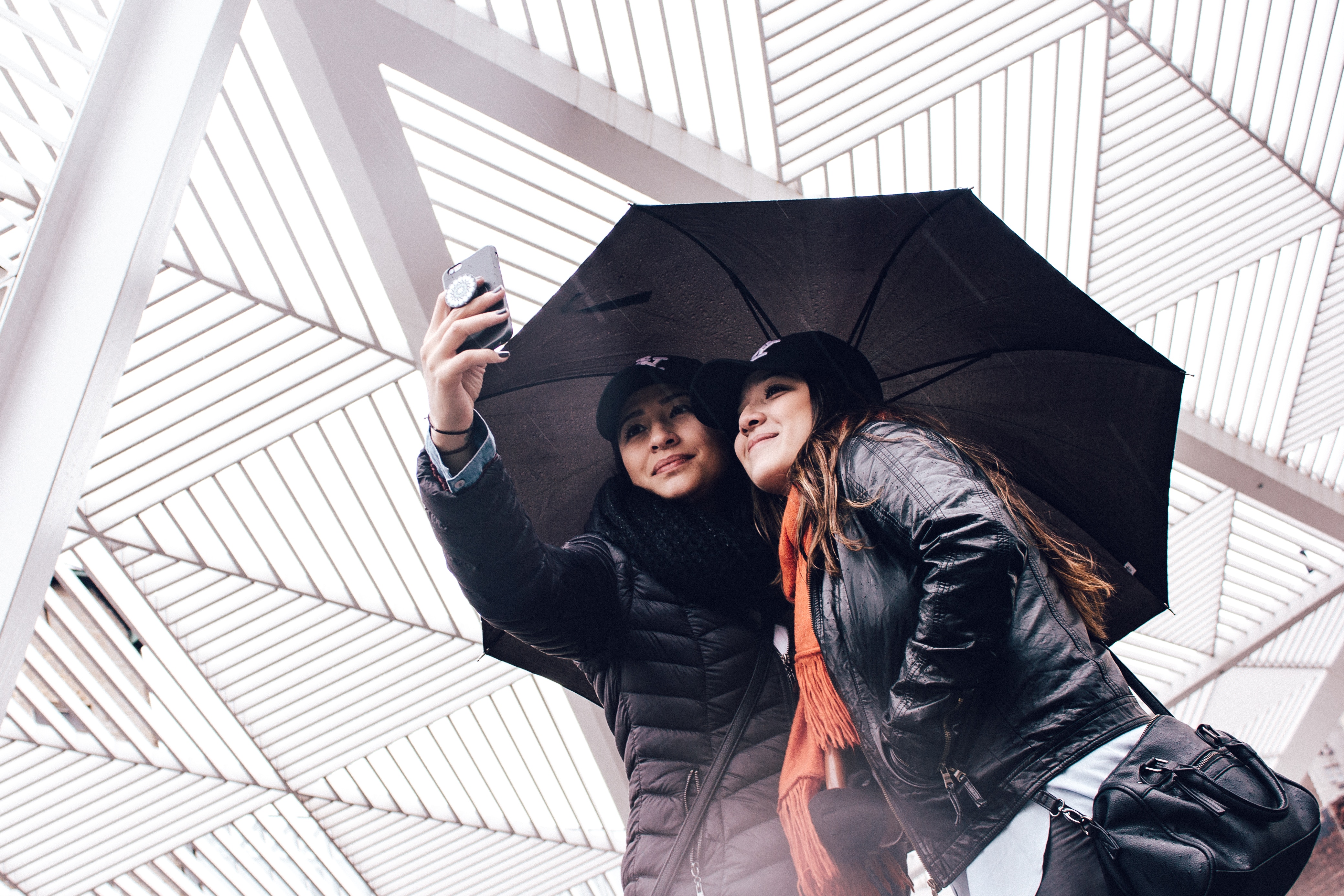 Girls Taking Selfies Under Umbrella